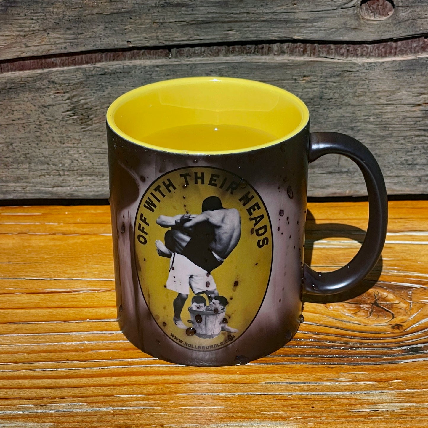 Experience the intensity of Jiu-Jitsu like never before with our Heat-Activated Coffee Cup! Witness an epic battle scene where one fighter locks in a guillotine choke on their opponent, while beneath them lies a bucket containing human heads. This captivating and unique design adds an extra layer of excitement to your coffee moments, making it a standout piece for any Jiu-Jitsu enthusiast's collection.
