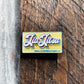 This pin has a retro twist - bright, colorful, and utterly unique. Its eye-catching design adds a playful yet sophisticated touch to your collection, making it a standout piece that is sure to spark conversations.